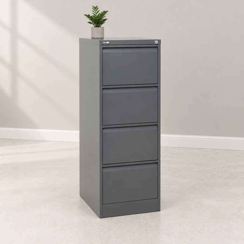 Grey four-drawer filing cabinet with a small plant in a light showroom
